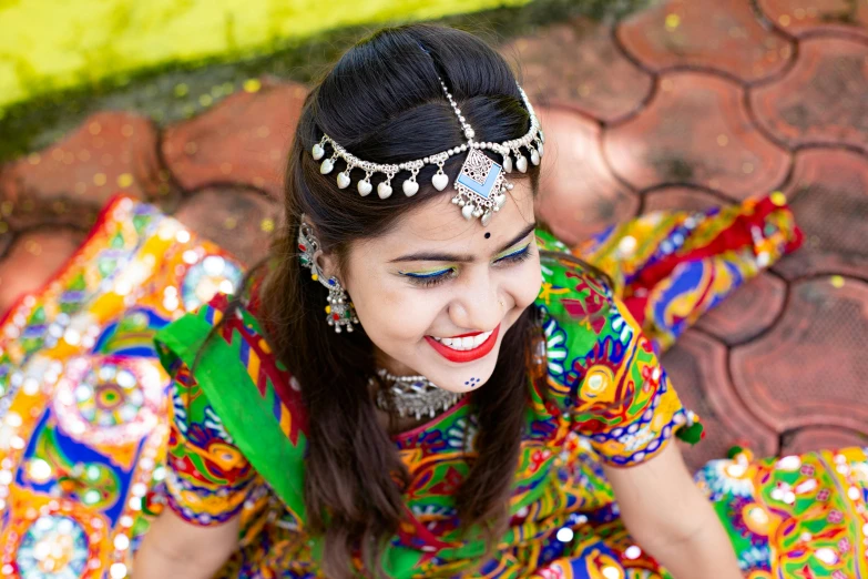 a girl wearing a head piece is smiling