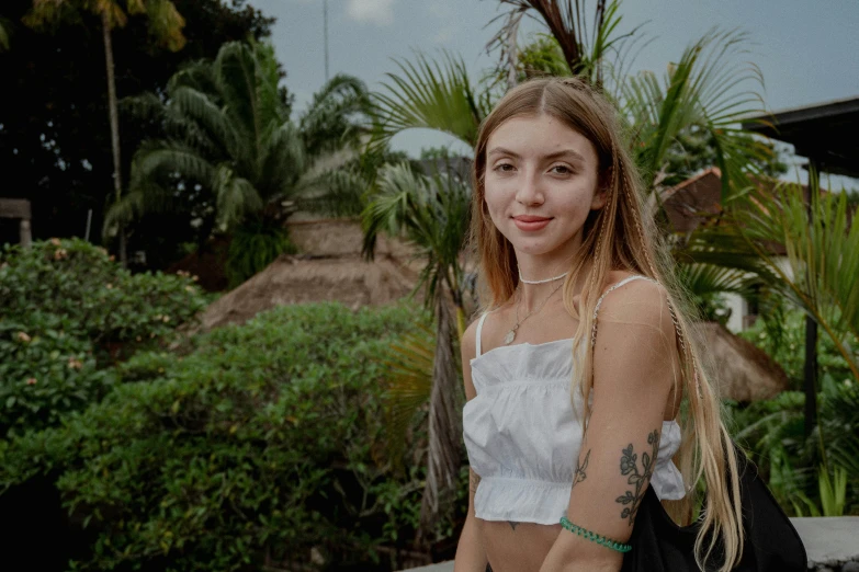 the girl is standing with her arms around her neck