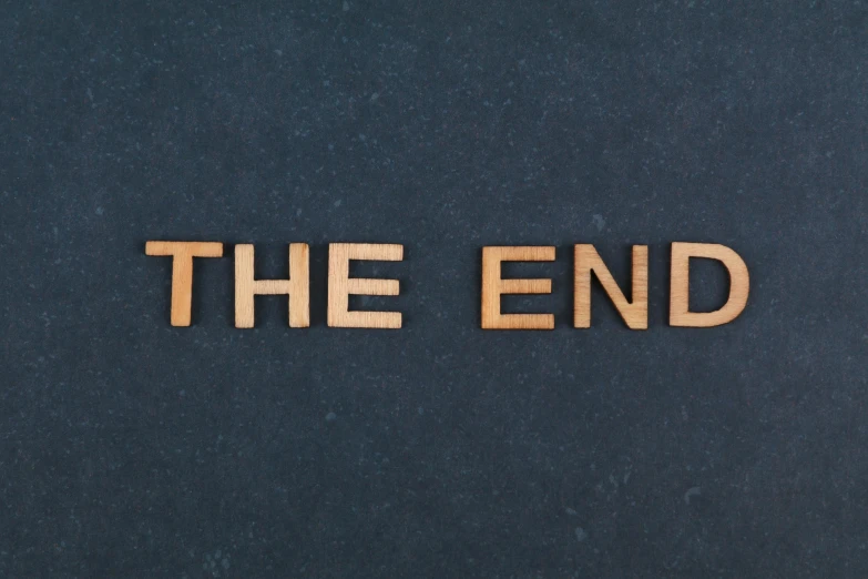 a wooden type reading the end