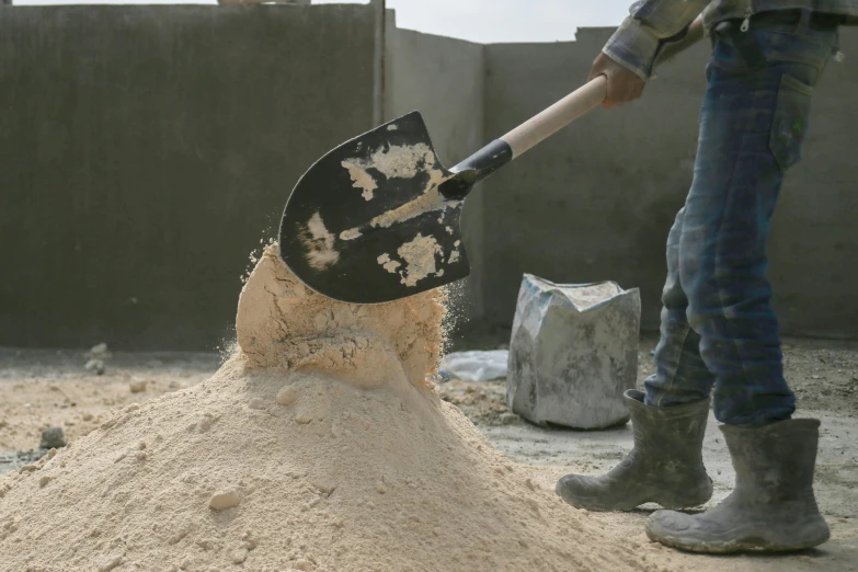 shovel is sticking in dirt that looks like dirt