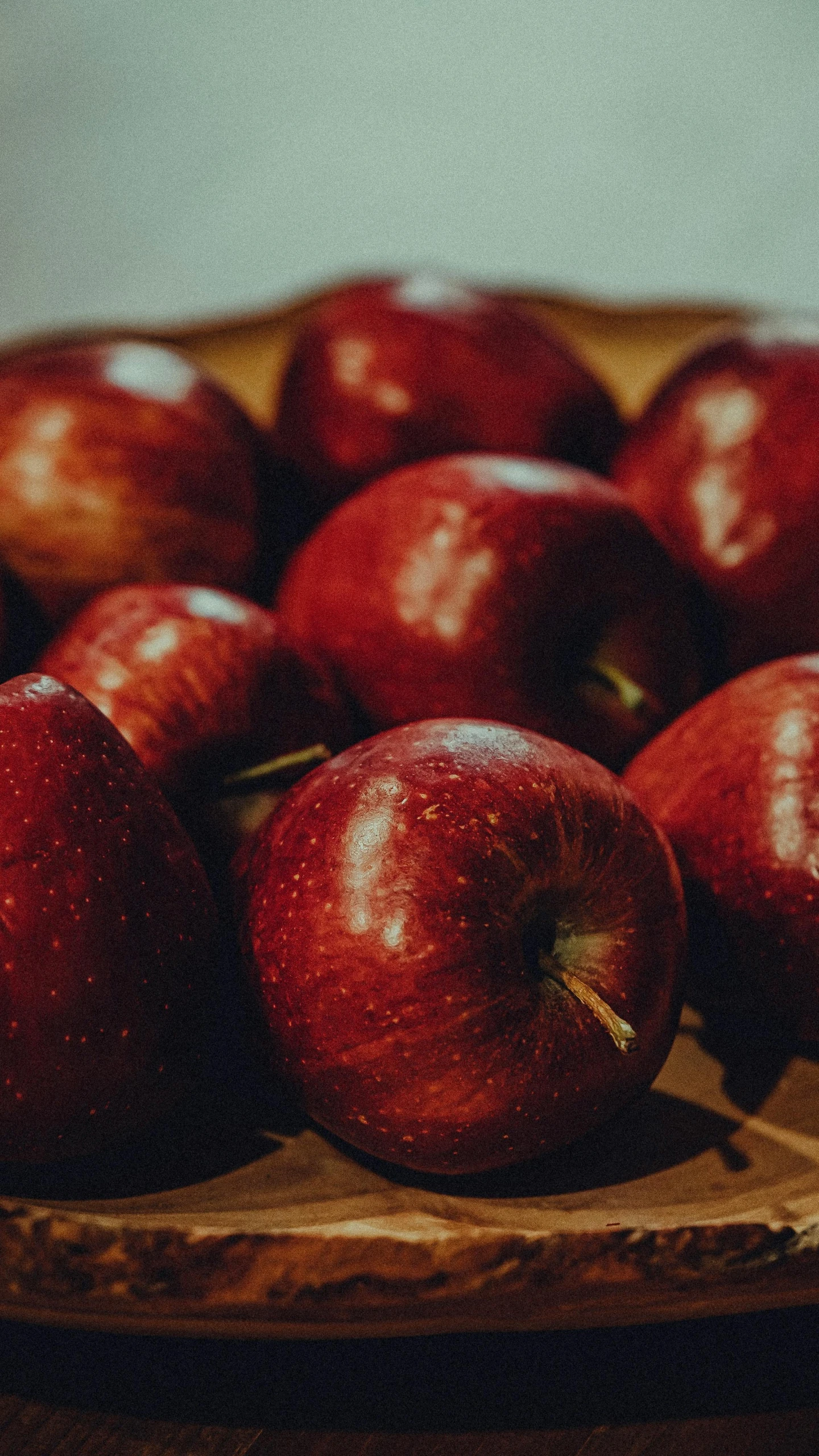 an apple tray has red apples on it