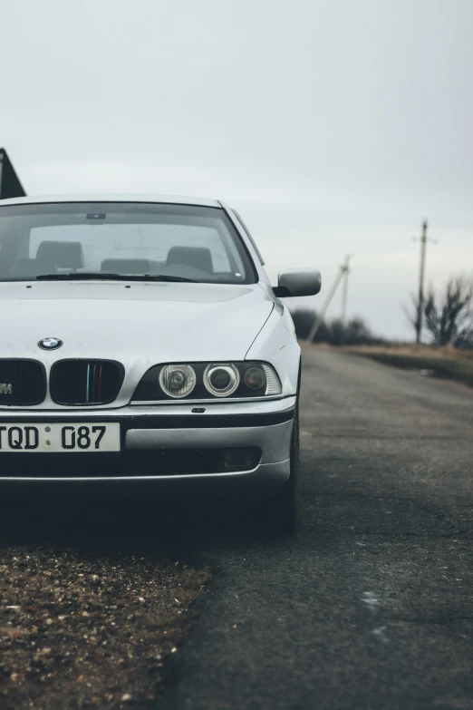 a white car parked on the side of the road