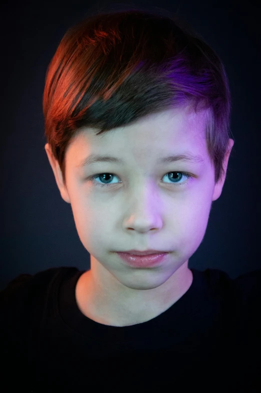 a young child with blue eyes and short hair