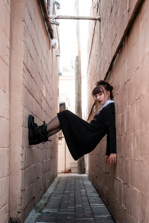 the woman is laying down on the brick wall