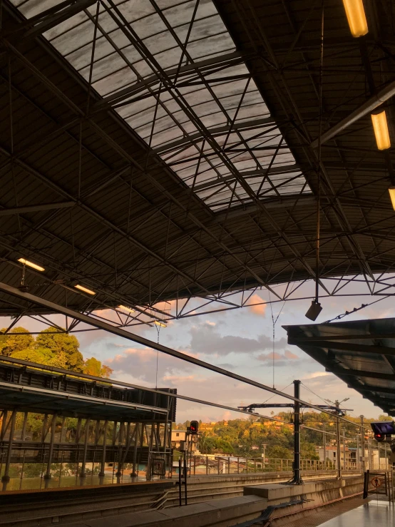 a train pulling into a train station under a tent