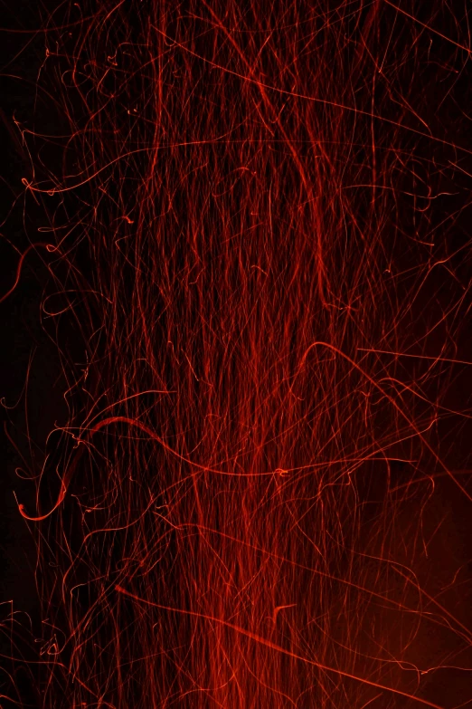 red lights swirling with orange streaks in the background