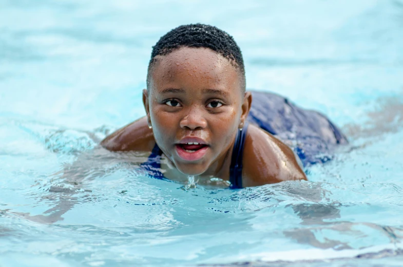 a  swimming in a pool of water