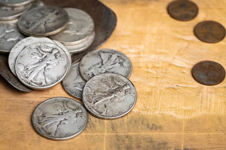 several coin pieces sitting on a table next to coins