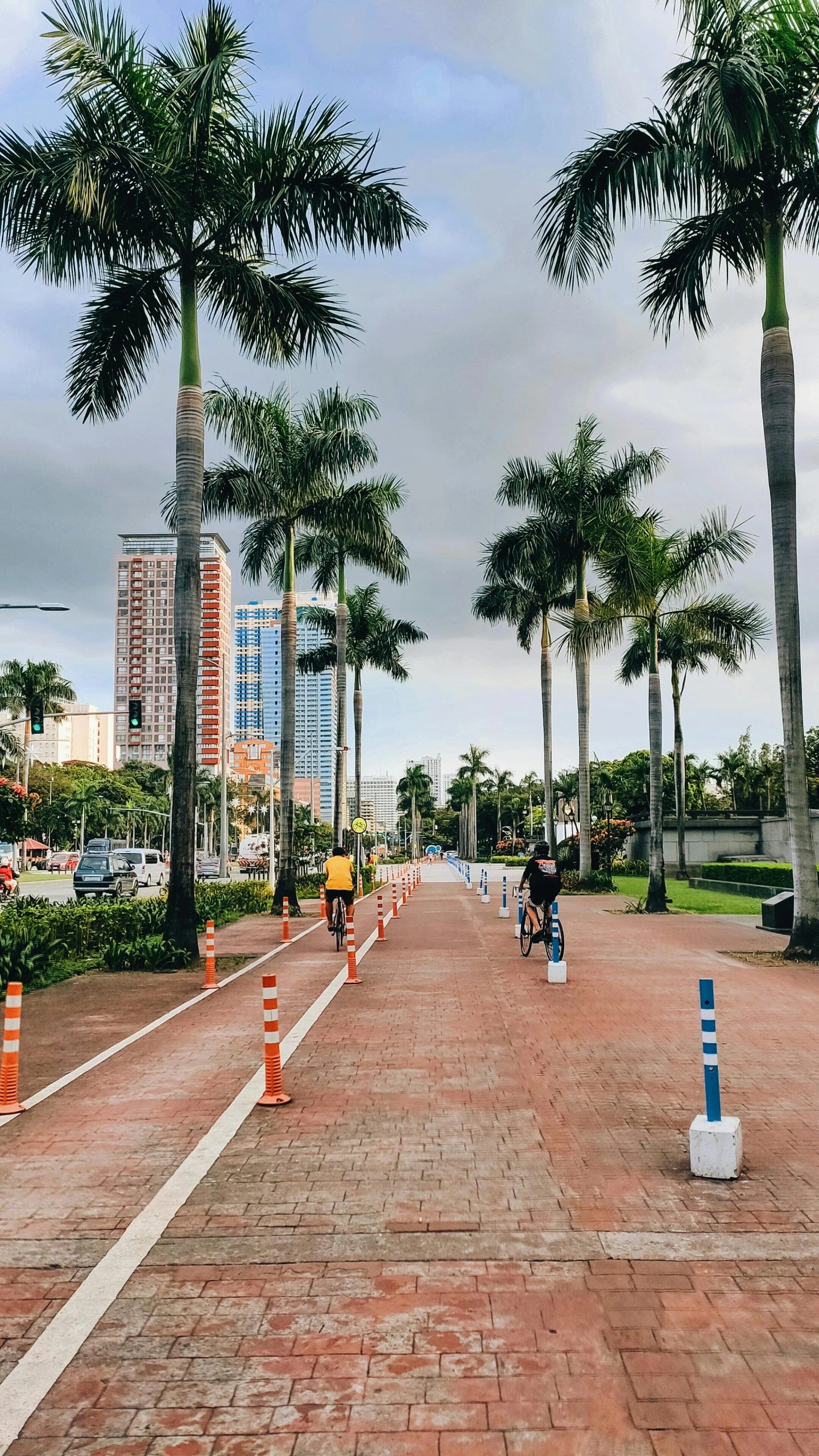 the man rides his bicycle down the red brick road