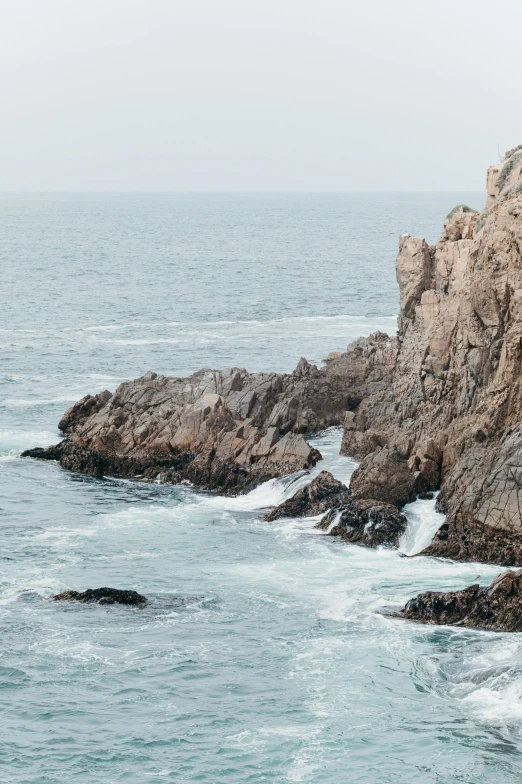 rocks with waves coming in on the top of them