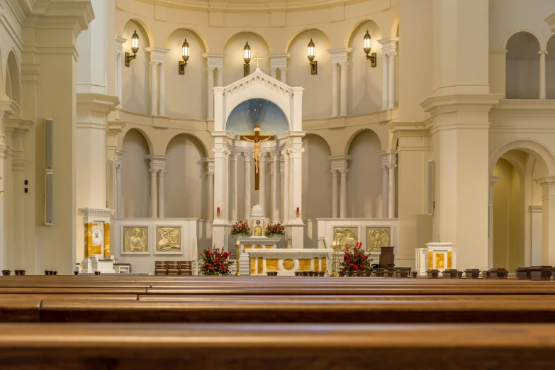 the interior of an old church, with pews on both sides