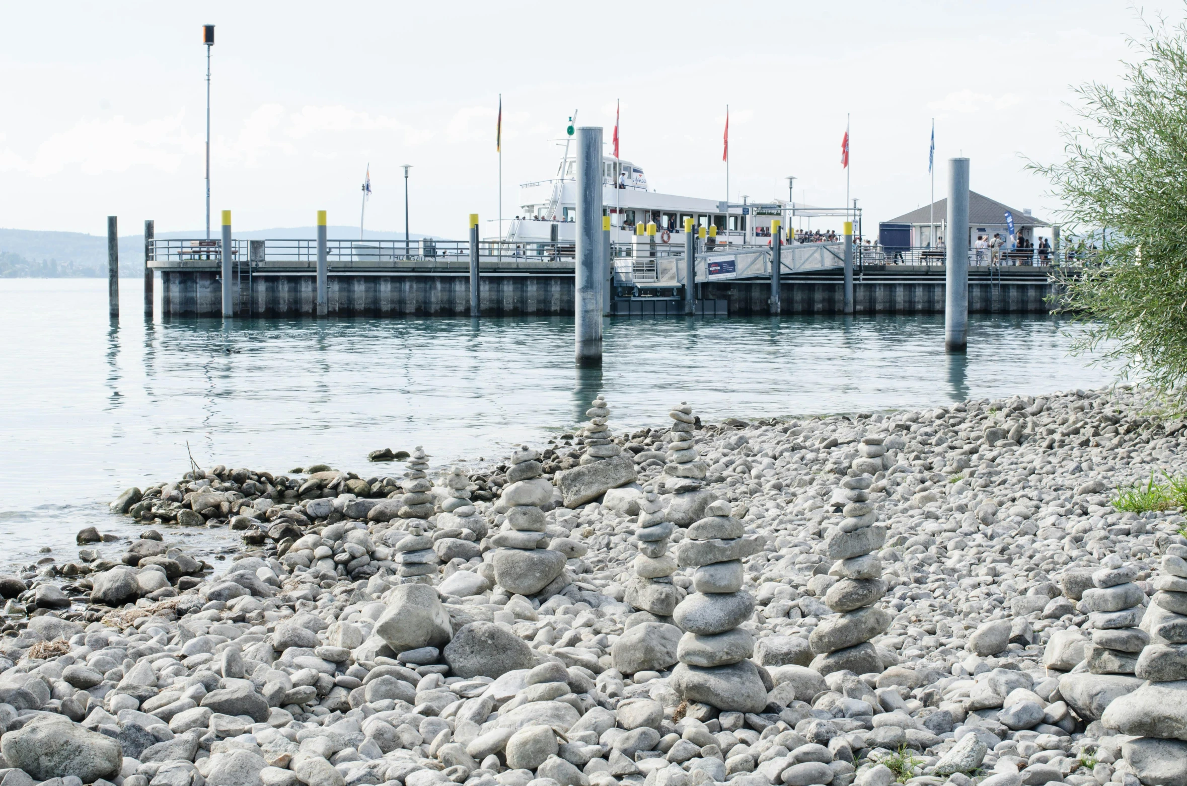 a rocky shore area with a boat in the water