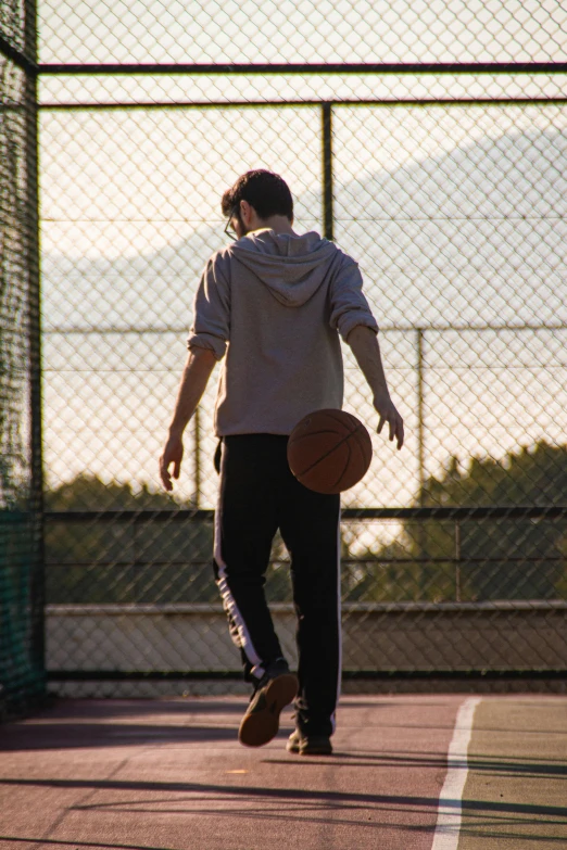 a person with a basketball and skate board