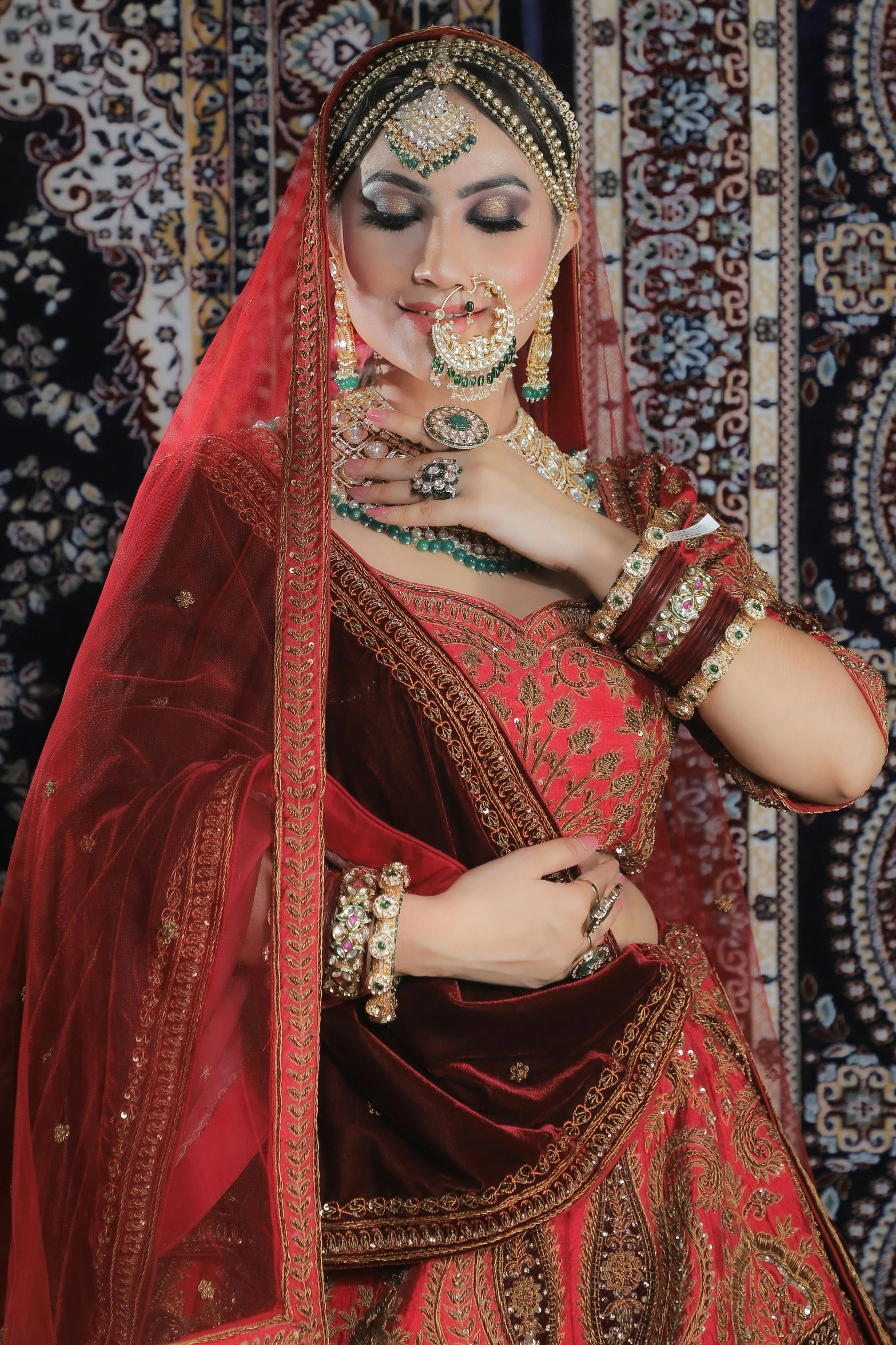 a woman is dressed in an elaborate indian wedding garb and jewelry