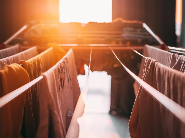 clothes hanging out to dry while sun sets