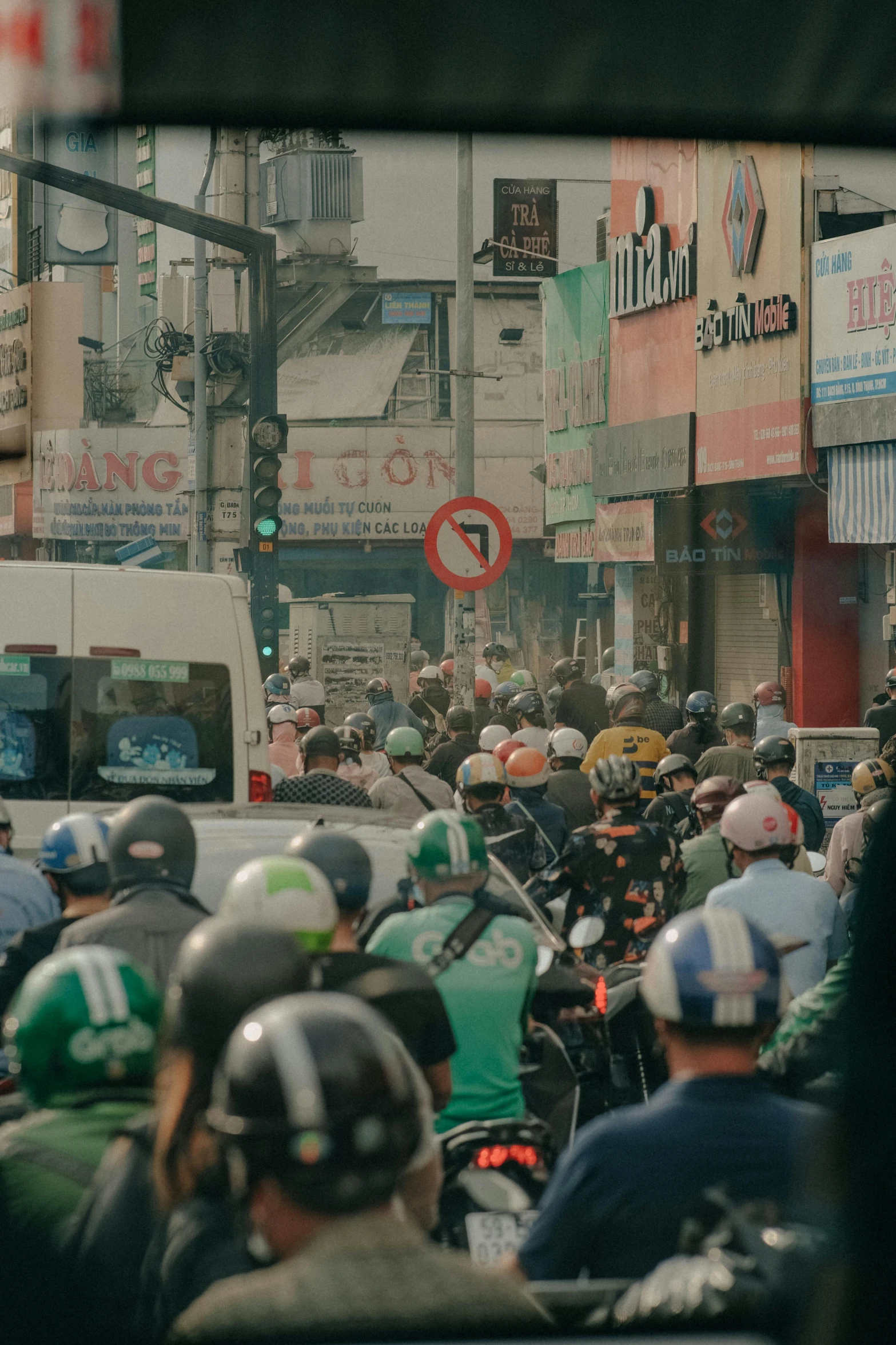 there are many people riding motorcycles down the street