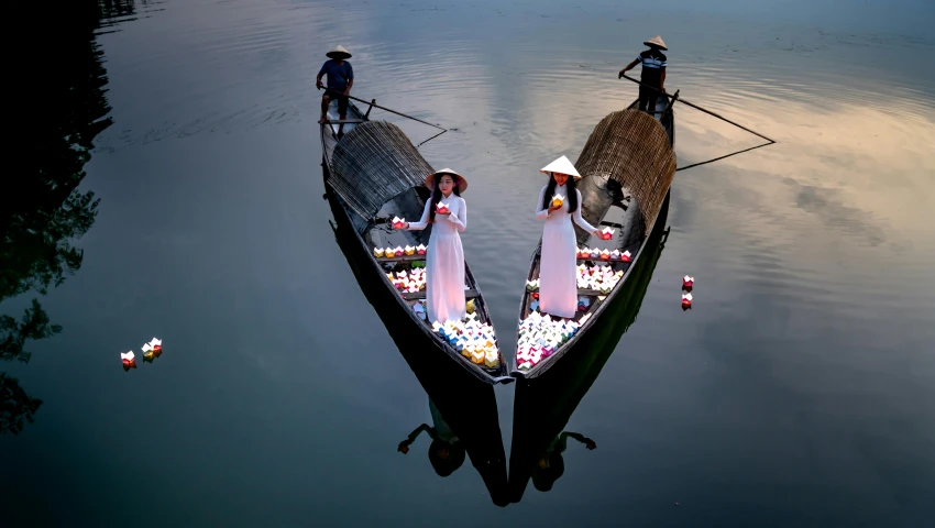 a couple of people in their boat on the water