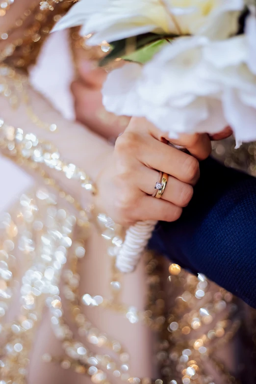 a close up s of a woman holding a bouquet of flowers