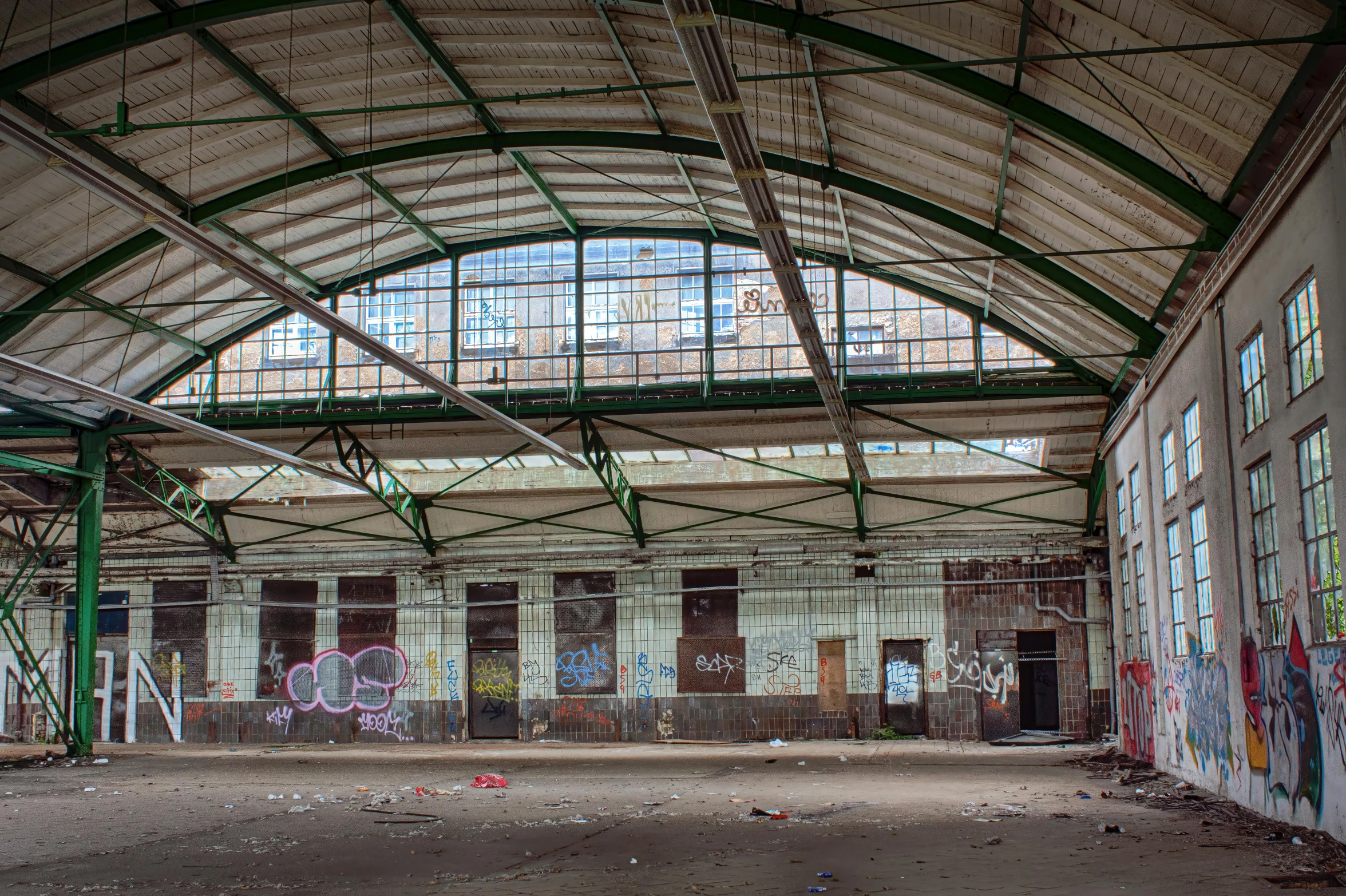 an abandoned warehouse building with lots of graffiti