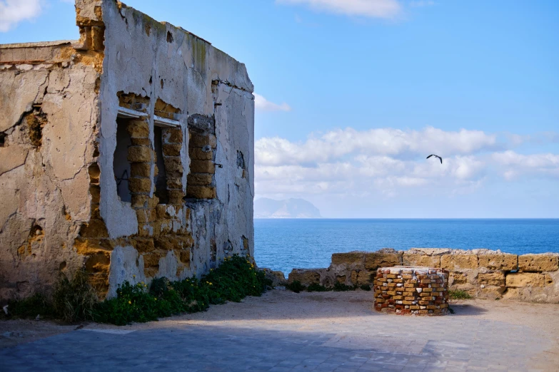 an old stone building near the ocean