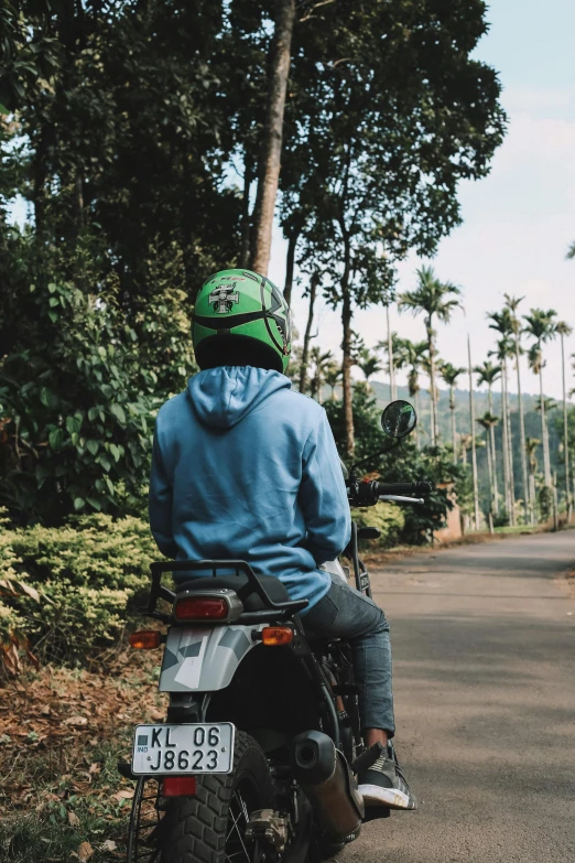 man on motor bike at the roadside road