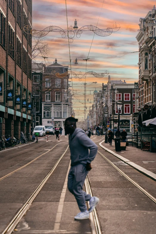 man skateboarding on sidewalk of street in urban area