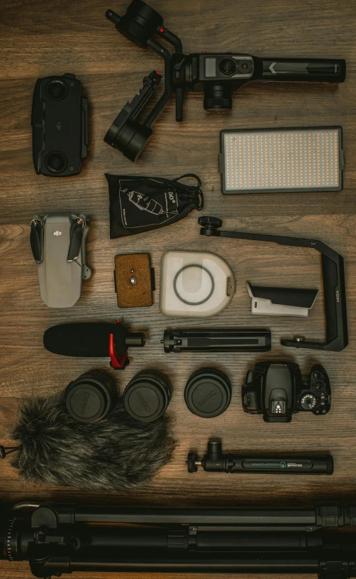 the contents of a camera laid out on top of a table
