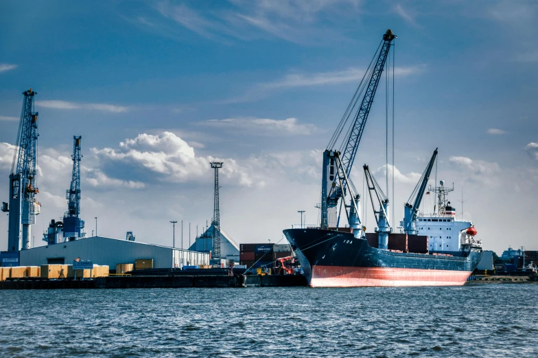 cargo ships parked at a port during the day