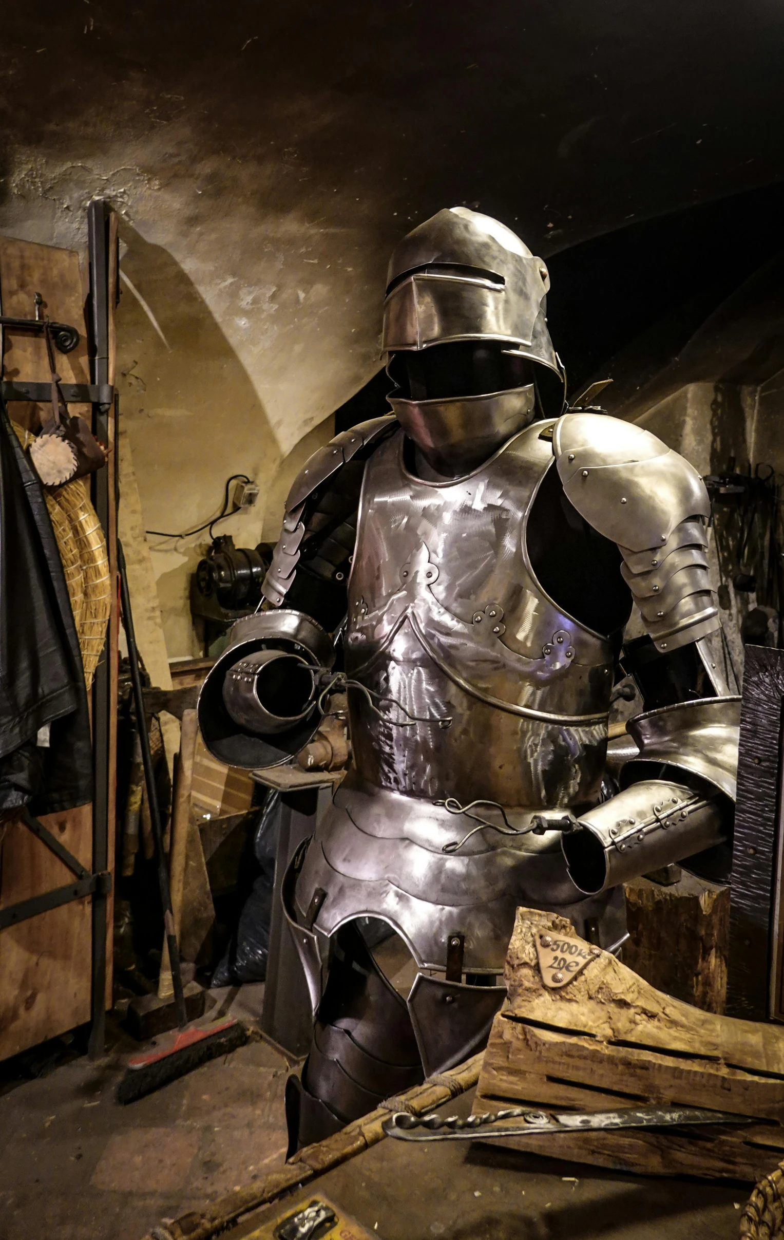 a man in armor holding a barrel of beer