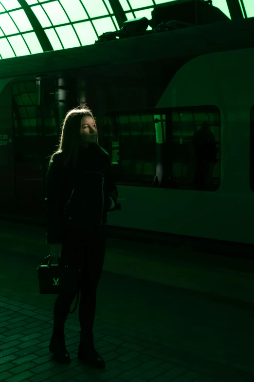 a person standing in front of a train