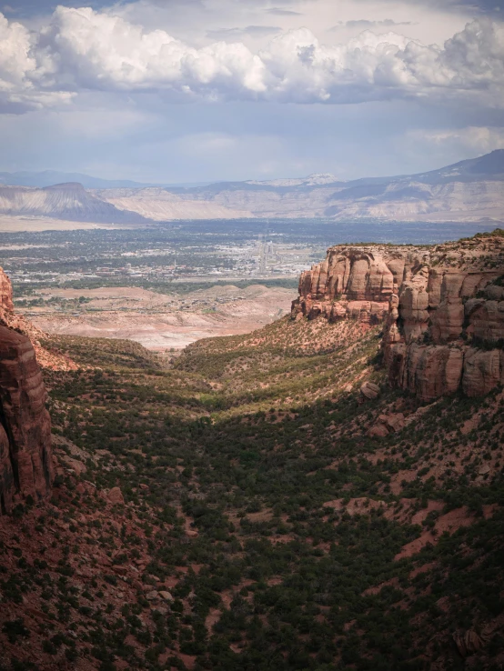 an area with many rocks and other vegetation, near mountains