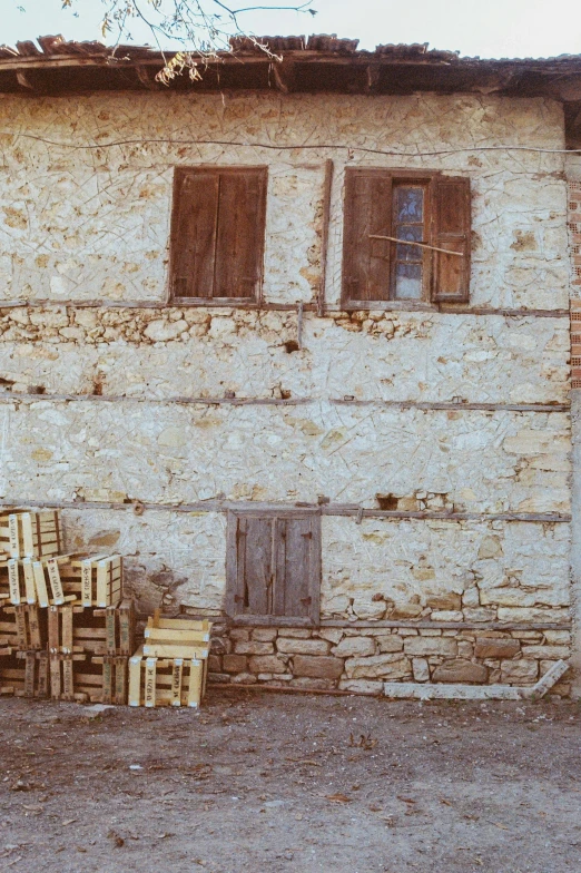 a man sitting on top of a wooden bench