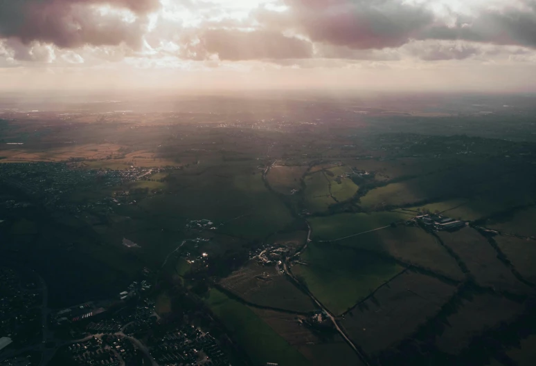 an aerial s of the sun and land on a cloudy day