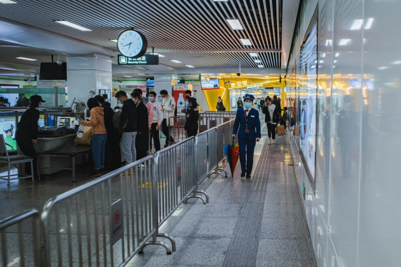 a large group of people standing in a building