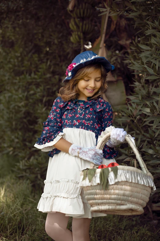 a little girl with her basket is smiling