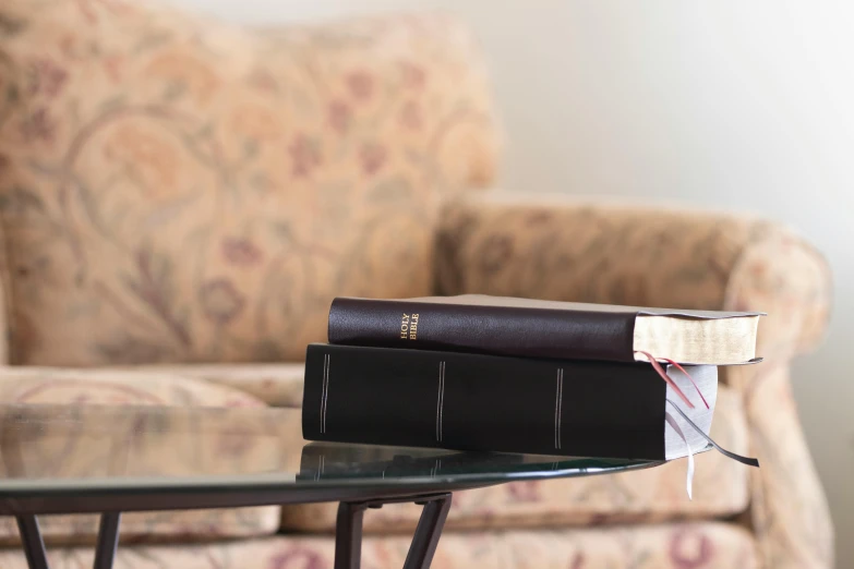 two books sitting on a table in a living room