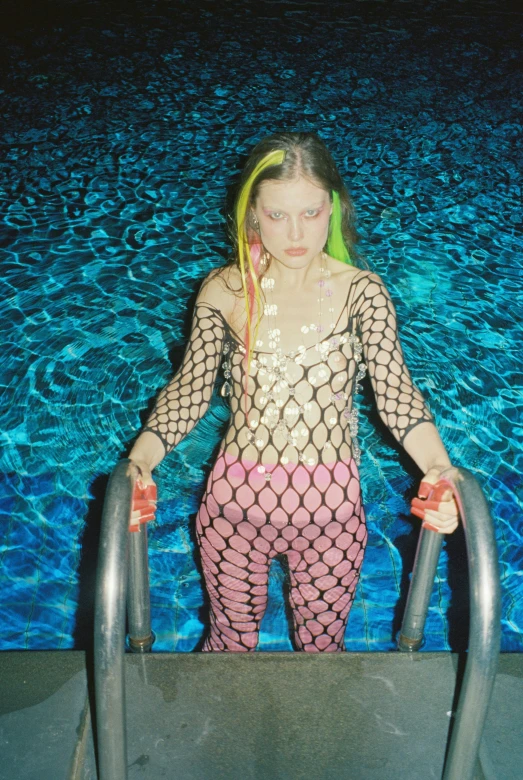 a young woman dressed in fish net outfits