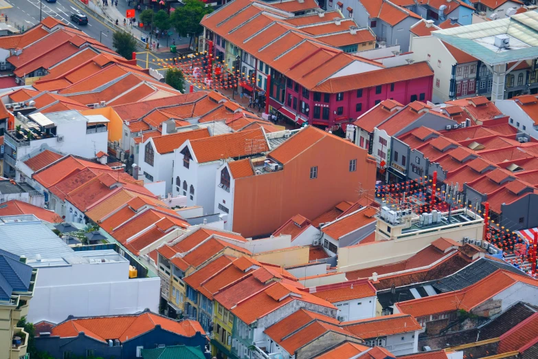 a cityscape of red tiled roofs is shown