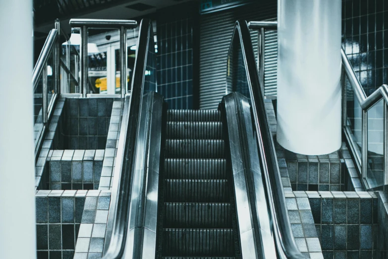 a metal and tile staircase with an empty set of stairs