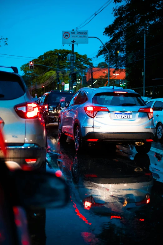 a number of vehicles on a street near one another