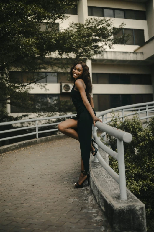 a woman standing on the side of a metal railing