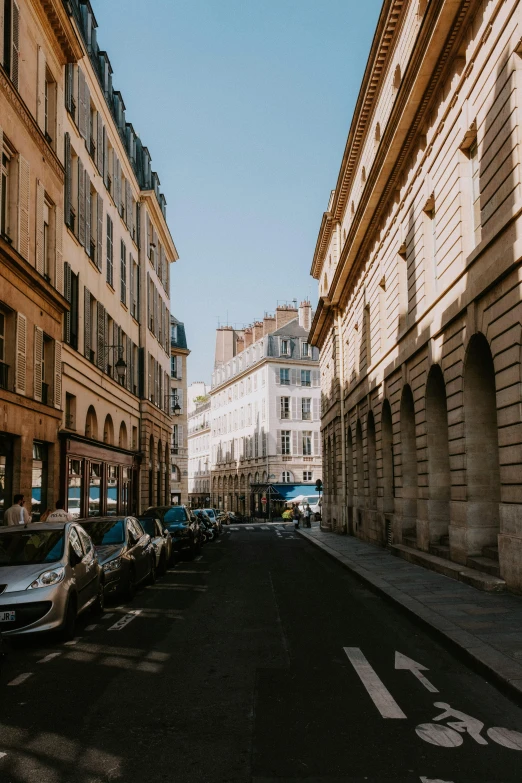 several buildings line the side of an empty street