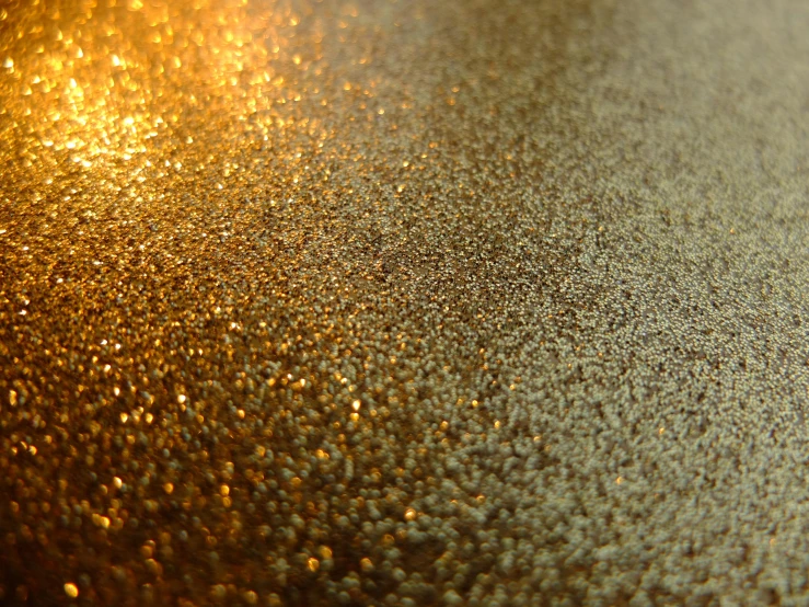 a close up of glitter gold flakes