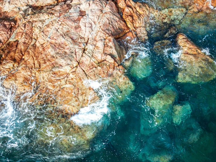 a large rocky shore line next to the ocean