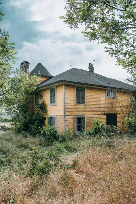 a run down house with boarded up windows