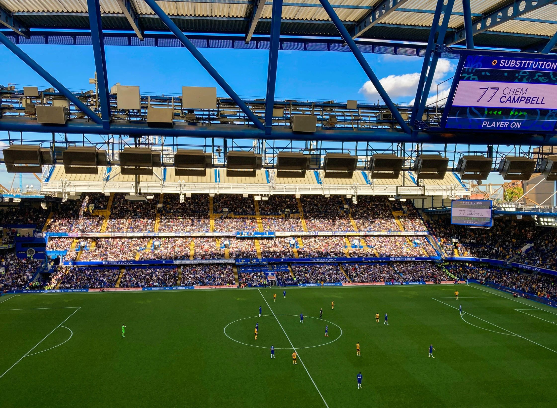 a soccer stadium full of people playing soccer