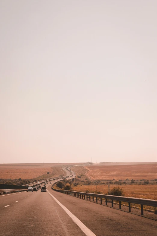 an empty highway is shown in the middle of nowhere