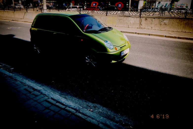 there is an image of an automobile parked on the street