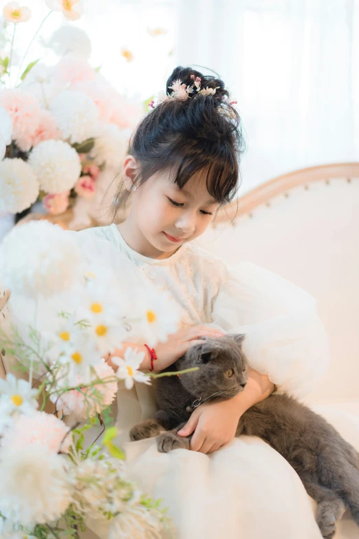 a  with her cat wearing a dress