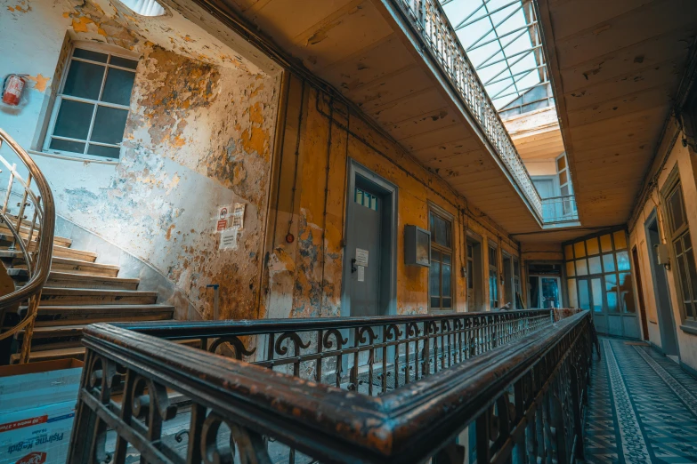 old building has metal stairs and an open window